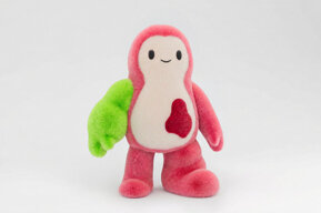 Kiki with an enlarged green arm and enlarged pink leg.
